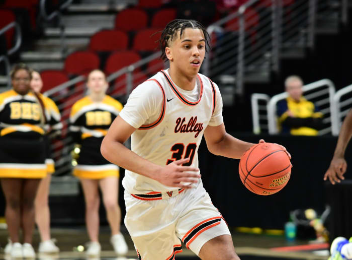West Des Moines Valley's Curtis Stinson drives to the hoop during a Class 4A state tournament semifinal against Bettendorf at Wells Fargo Arena in Des Moines on Thursday. (Photo by Ryan Timmerman)